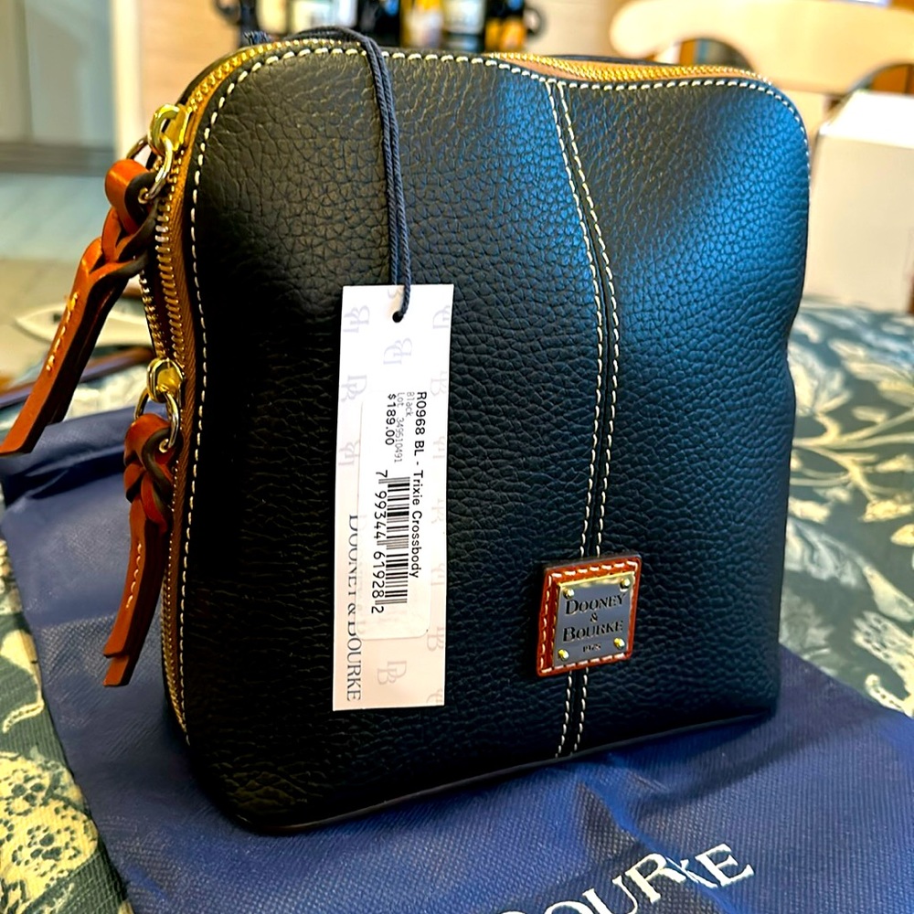 Dooney &Bourke Trixie black pebbled leather with contrast stitching.